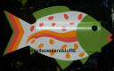 colorful speckled tropical  fish with lime green, white and oranges. Tutti fruiti fish !